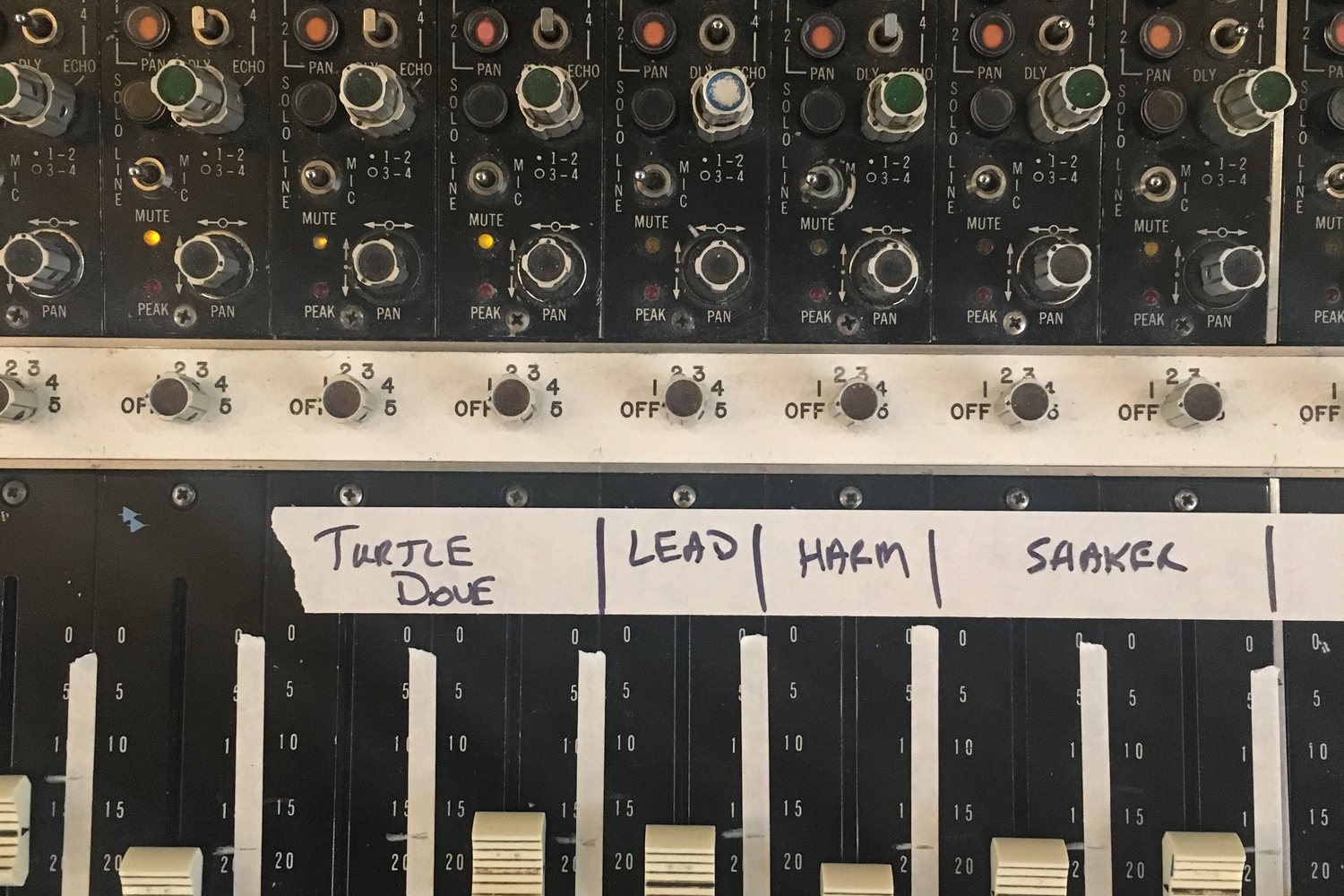 Console channel strips with handwritten track labels