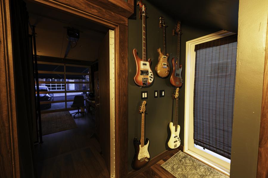 Guitar wall by the entry